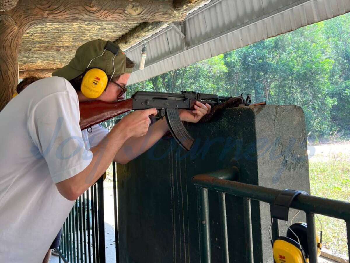 The tourists are experiencing the AK-47 at the shooting range.