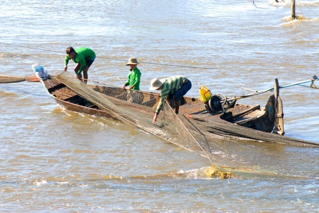 The people are fishing in the Mekong River.