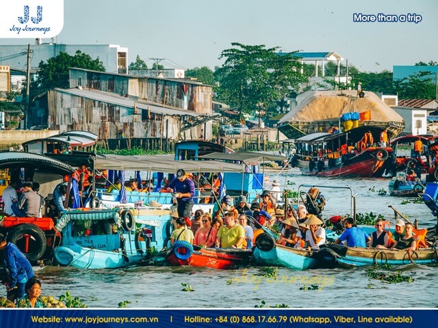 Tourists visit the Cai Rang Floating Market on Joy Journeys' tour.