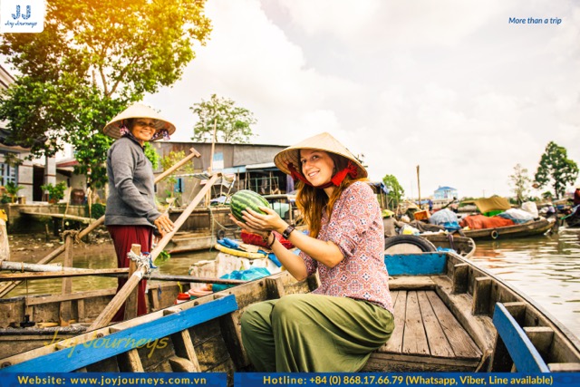 Tourists on the "Mekong 'Cai Rang' Floating Market 2 Days" tour by Joy Journeys during autumn.