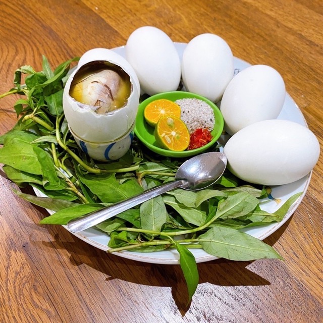 Cracking A Part Of The Shell To Eat Boiled Balut