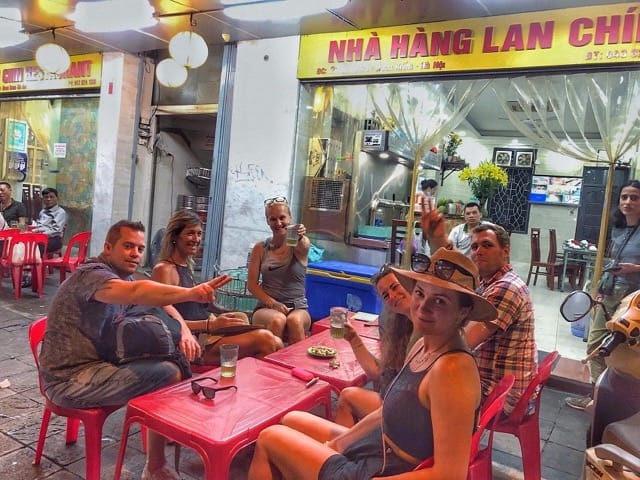 Sidewalk Pubs Are Crowded in The Evening