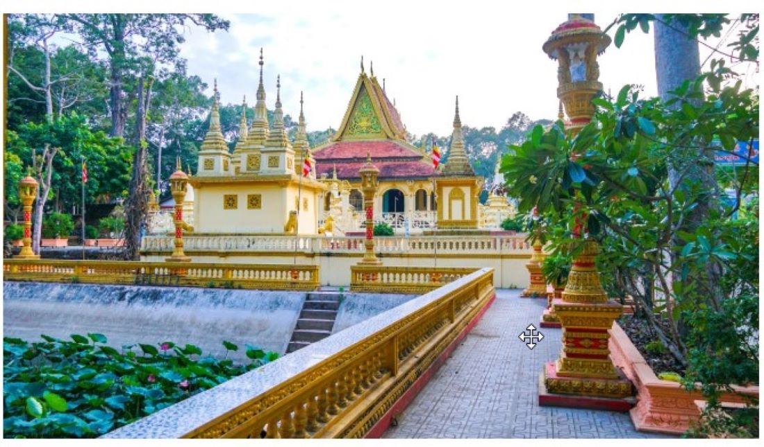 Tourists marvel at the beauty of traditional Khmer architecture of Ang Pagoda during their Mekong Delta tour